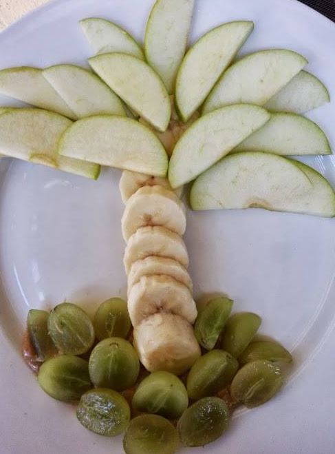 Island Food Art made with apples, bananas and grapes