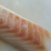 A long piece of white cod fish.