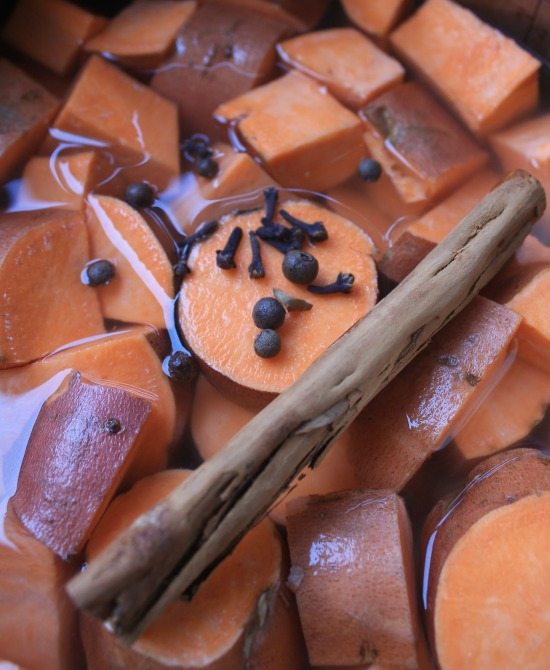 Sweet Potatoes Cooking with a cinnamon stick and cloves