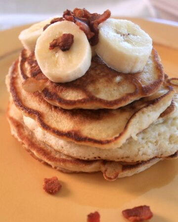 Banana Bacon Pancakes is a mix of savory and sweet. This fluffy breakfast will make you swoon. Enjoy! by Mama Maggie's Kitchen