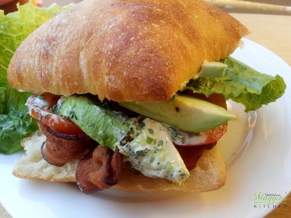BLTA Sandwich with Mayo , Bacon, Lettuce, Tomato, and Avocado on a bun 
