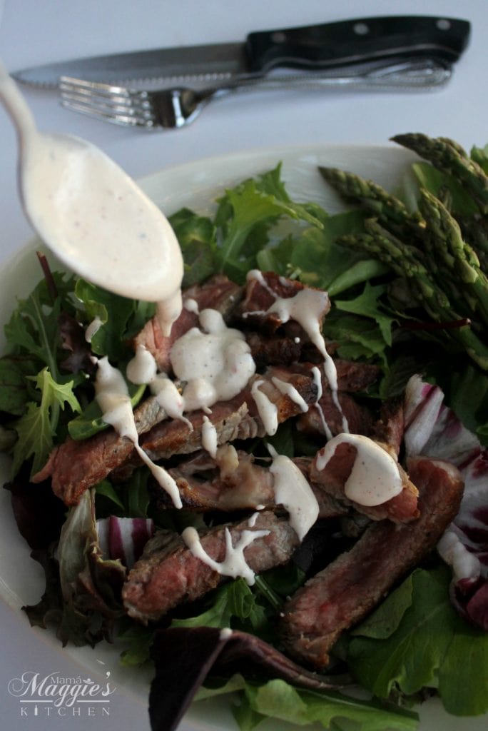 Pouring Blue Cheese Dressing to the Steak Salad with Low Calorie 