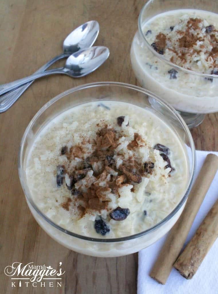 Arroz con Leche served in 2 glasses next to 2 spoons