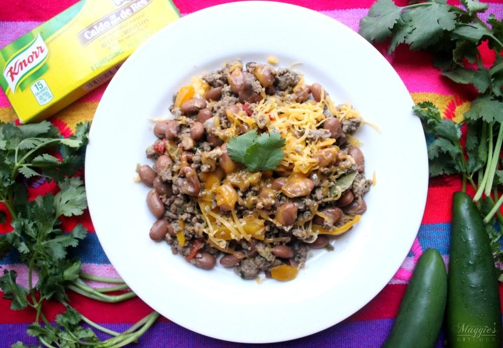 One Pot Mexican Beef and Beans served in a plate and decorated with cilantro and ciles