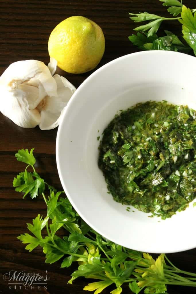 Chimichurri Sauce is an uncooked, herb garlic sauce that is used on grilled meat. Serve it at your next BBQ. Everyone will love it! By Mama Maggie’s Kitchen