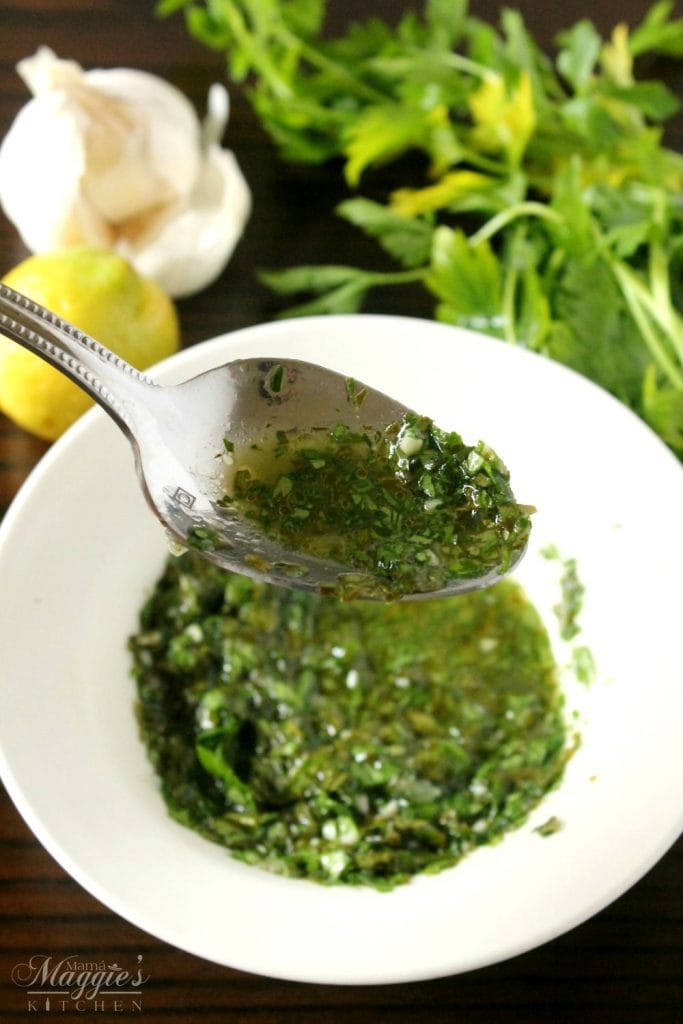 Chimichurri Sauce is an uncooked, herb garlic sauce that is used on grilled meat. Serve it at your next BBQ. Everyone will love it! By Mama Maggie’s Kitchen