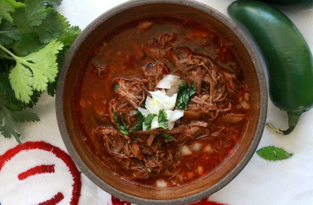 Birria de Res, or Mexican Beef Stew, is a traditional Mexican dish that is hearty, delicious, and full of amazing, robust flavors. by Mama Maggie's Kitchen