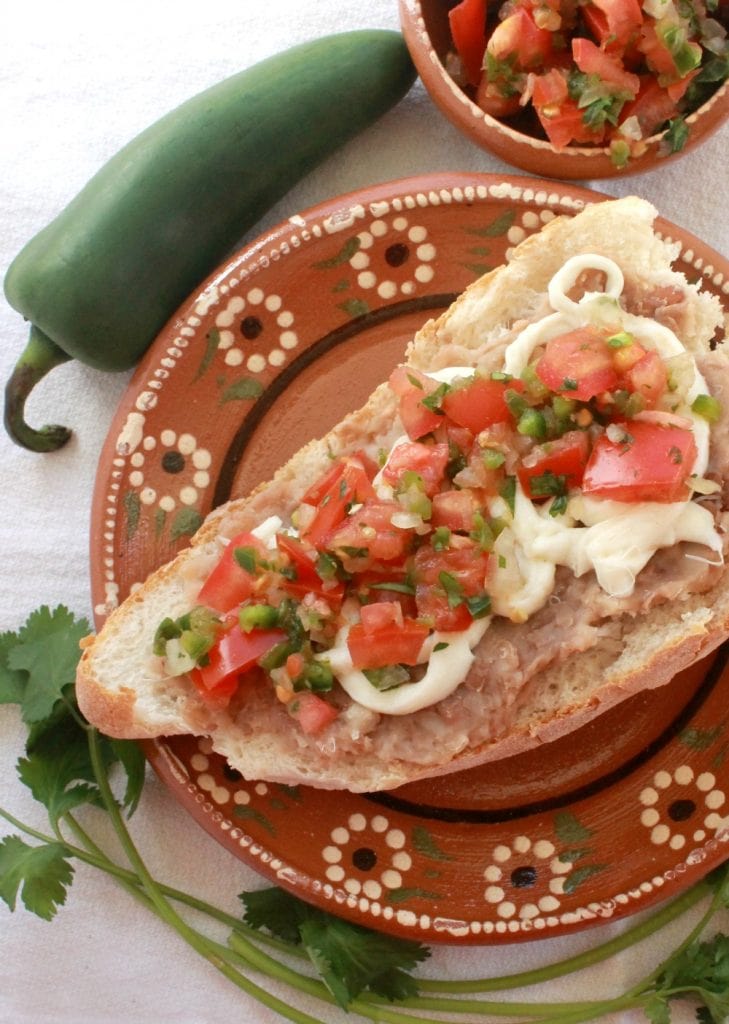 Molletes (or Open-Faced Mexican Sandwich) is a yummy breakfast idea or perfect as a quick afternoon snack. Mexican food doesn’t come any easier than this! By Mama Maggie’s Kitchen
