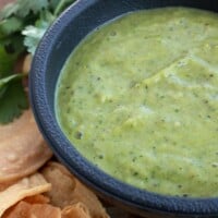 Roasted Tomatillo Salsa Verde is incredibly easy to make. Delicious and savory. Perfect with chips or as a topping for tacos. By Mama Maggie’s Kitchen