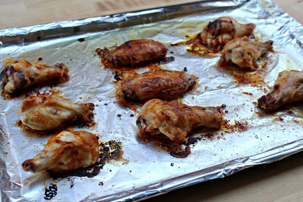 Chicken wings baked on a baking sheet. 