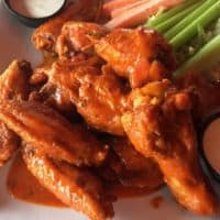 Spicy Buffalo Chicken Wings are incredibly fast and easy-to-make. They make a tasty appetizer that everyone will love. By Mama Maggie’s Kitchen