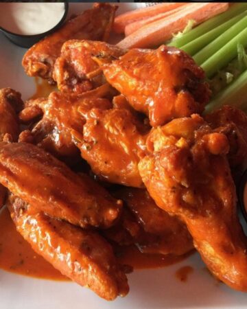 Spicy Buffalo Chicken Wings are incredibly fast and easy-to-make. They make a tasty appetizer that everyone will love. By Mama Maggie’s Kitchen