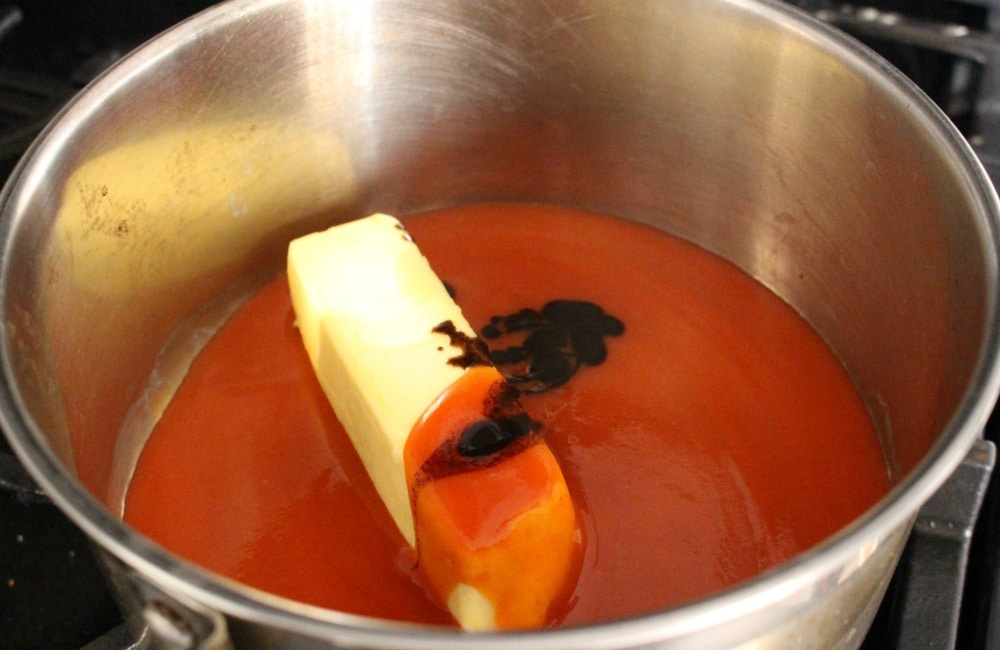 Making Buffalo Chicken Wings sauce in a metal saucepan. 