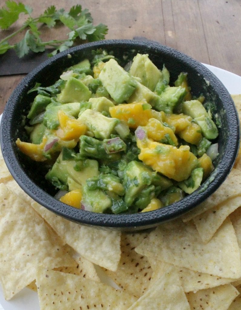 Avocado Mango Salsa is a yummy appetizer or the perfect topping for your next chicken or fish dinner. By Mama Maggie’s Kitchen