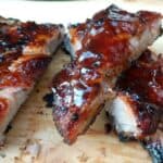 Spice-Rubbed Ribs with Chipotle BBQ Sauce has a great balance of spicy and sweet flavors. Perfect for summer BBQs and grilling fun. By Mama Maggie’s Kitchen