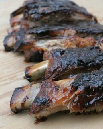 Grilled Ribs with Tamarind BBQ Sauce are full of bold, sweet, and spicy flavors. They scream summer fun by the grill. By Mama Maggie's Kitchen