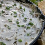 This warm Hatch Chile Cheese Dip will be the hit of any gathering. Perfect for your next Super Bowl party. By Mama Maggie’s Kitchen