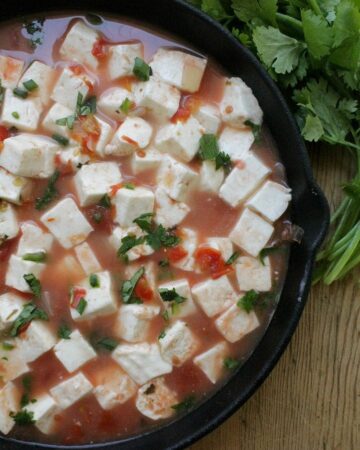 Queso Panela en Salsa Roja, or Panela Cheese in Mexican Red Salsa, is a delicious appetizer that also makes a great light meal. Creamy and not too spicy. By Mama Maggie’s Kitchen
