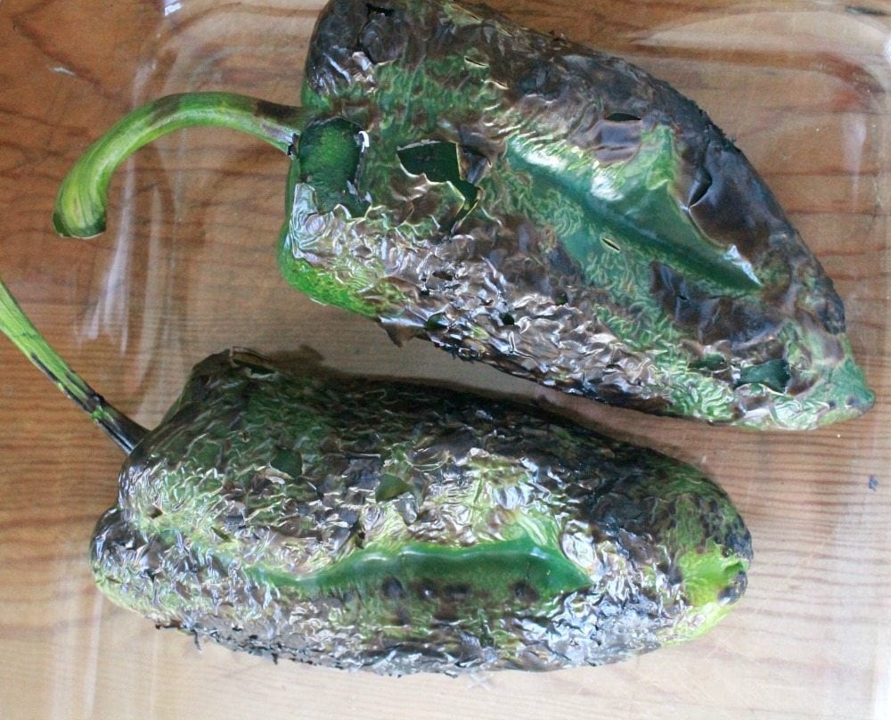 Roasted Poblano Peppers in a glass dish.