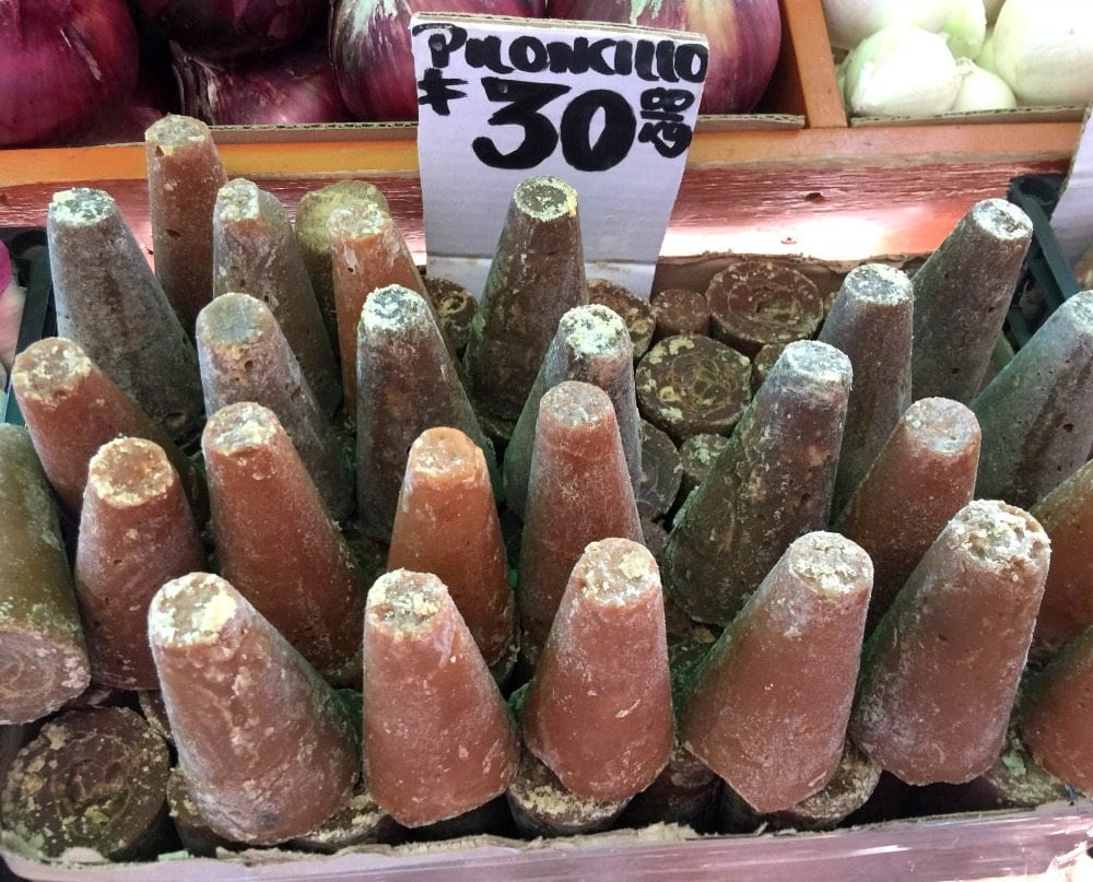 A stand with several piloncillo cones.