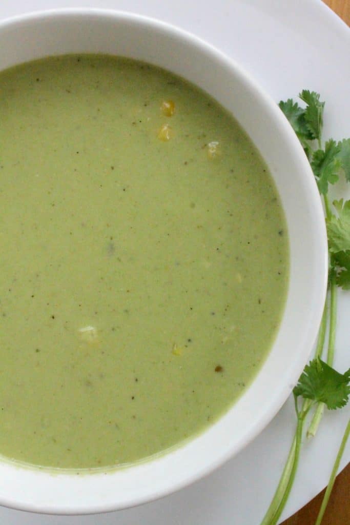 Roasted Poblano and Corn Soup is delicious, rich, and deeply satisfying. Instead of a pot of gold, this a big pot of yummy green. Hope you enjoy! By Mama Maggie’s Kitchen