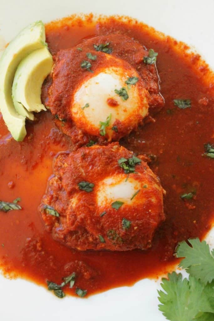 Drowned Eggs in Guajillo Sauce, or Huevos Ahogados en Chile Guajillo, is a classic Mexican recipe. Delicious and savory. Perfect for breakfast, lunch, or dinner. By Mama Maggie’s Kitchen