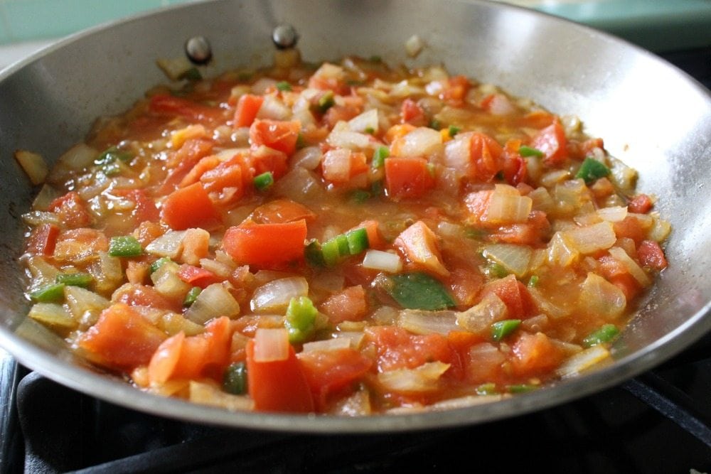 Diced Tomato, Jalapeno, Onion cooking in a skillet