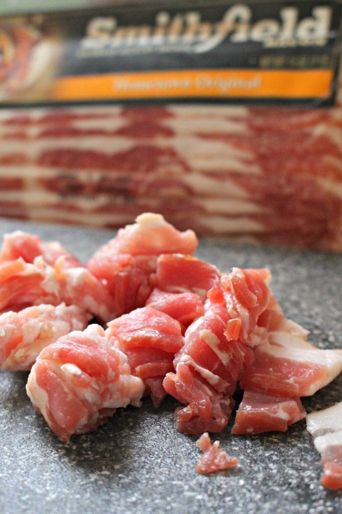 Chopped bacon with bacon package in the background