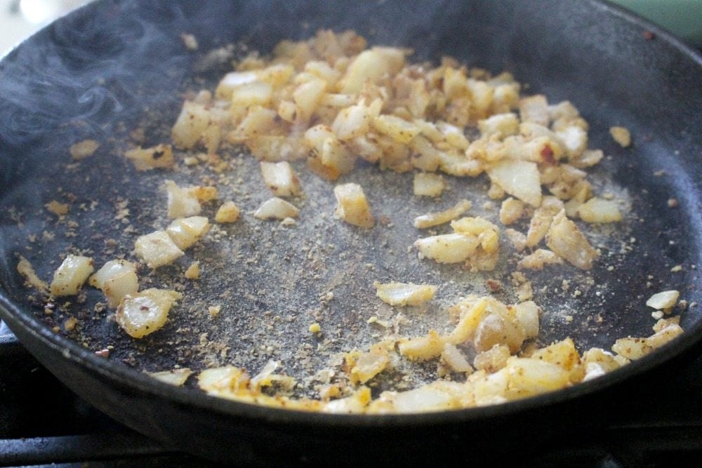 Flour Cooking with Onions in black iron skillet