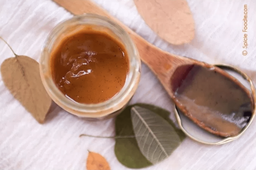 Mexican goat milk caramel with wooden spoon and leaves