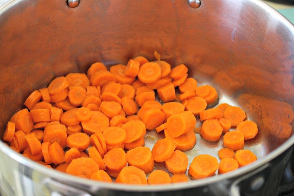 Carrots cooking a stock pot.