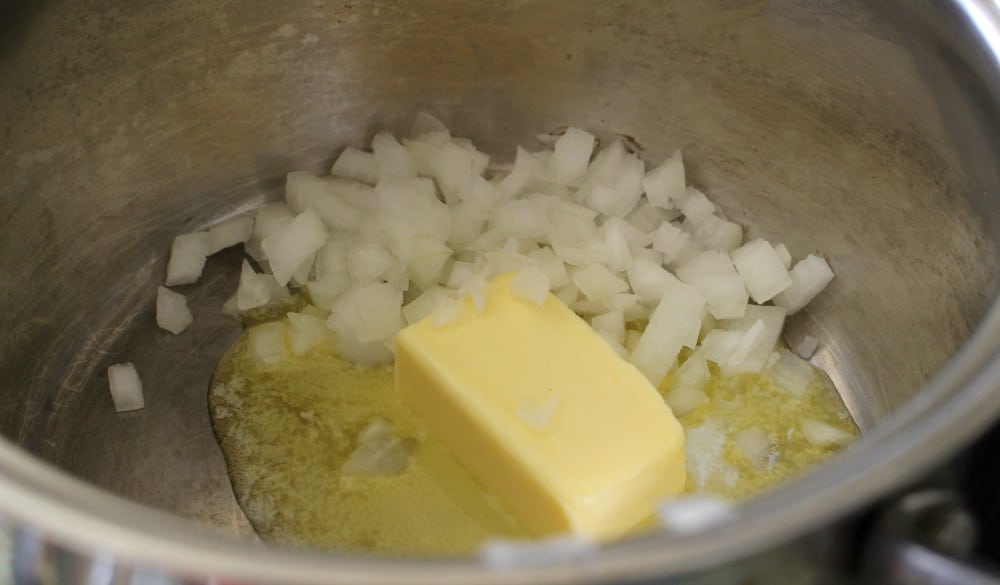 Butter and diced onions cooking in a stock pot