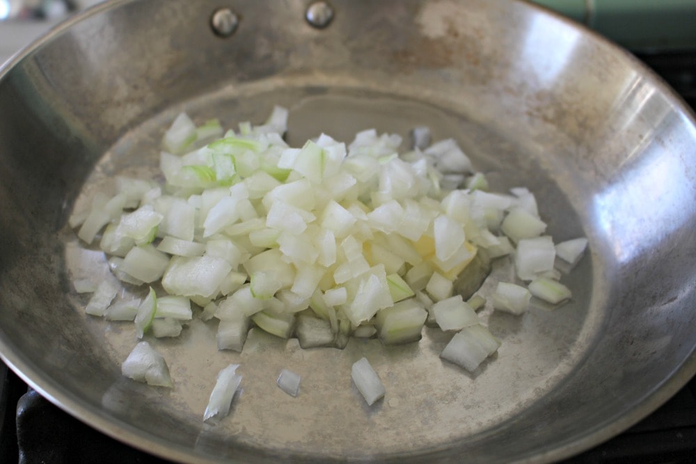 Diced onion with butter in a skillet