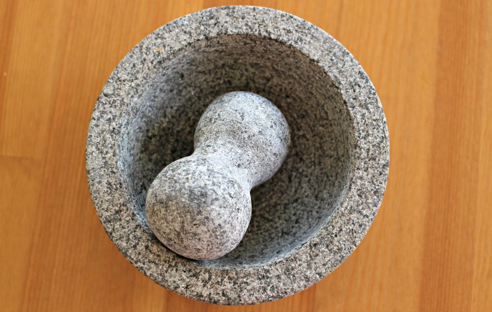 A molcajete on a wooden table.