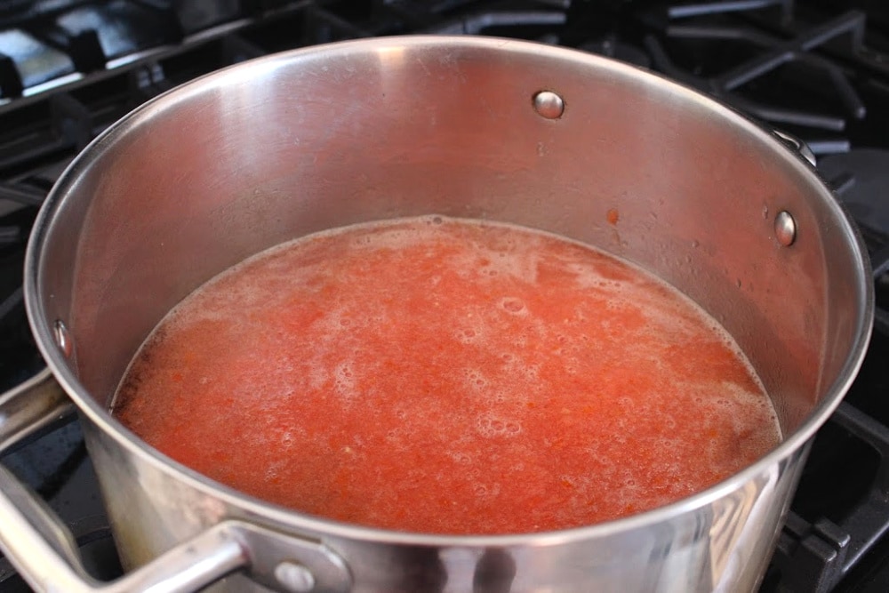 Tomato sauce in a metal stock pot.