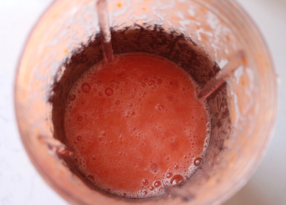Blender with tomato sauce inside. 
