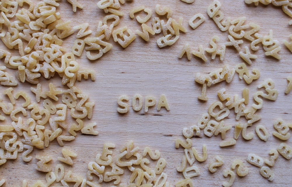 Alphabet pasta spelling out "SOPA" or "soup" in Spanish.