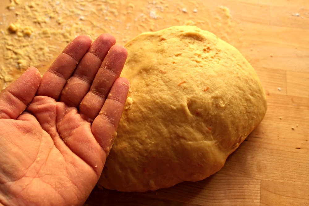 Clean hand over the dough for Rosca de Reyes.