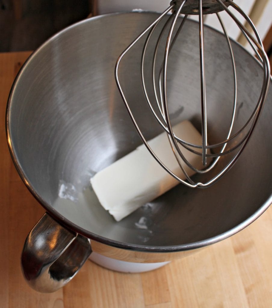 A bar of shortening in a Kitchen Aid with the whisking attachment.