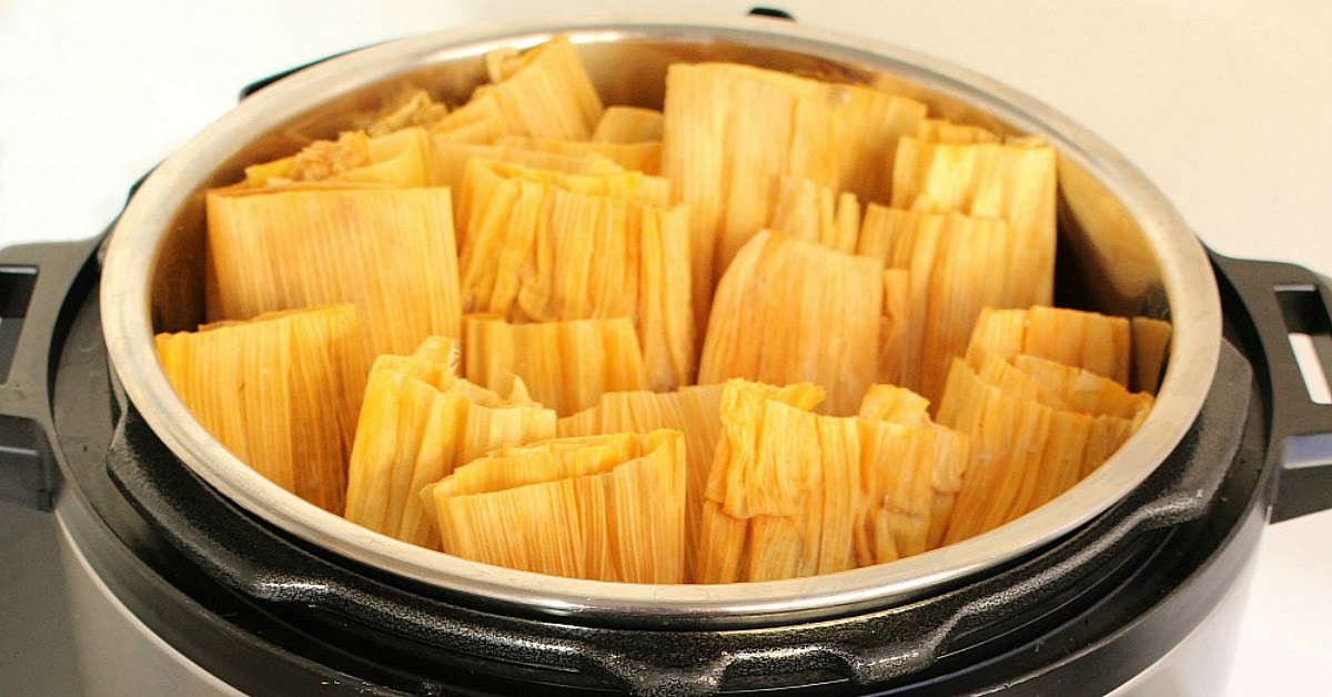 Instant Pot Pork Tamales are incredibly tasty and perfect for your next fiesta. This authentic Mexican recipe is ready in almost half the time. By Mama Maggie's Kitchen