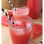 Watermelon Agua Fresca glasses with straws.