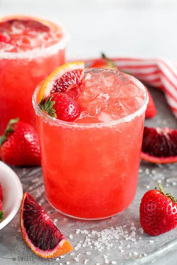 Strawberry Margarita topped with blood oranges and strawberries.