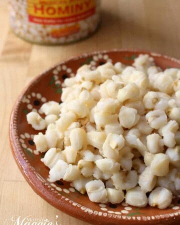 Hominy kernels on a decorative Mexican clay plate.
