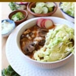Mushroom Vegan Pozole in a white bowl topped with cabbage and sliced radishes.