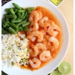 Camarones Enchipotlados served with green beans and rice.