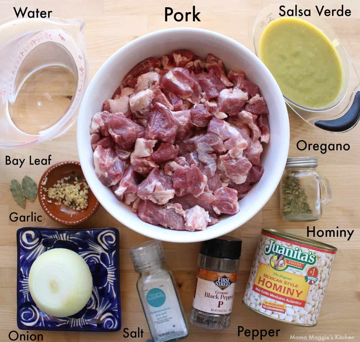 Ingredients for Instant Pot Pozole Verde on a wooden surface.