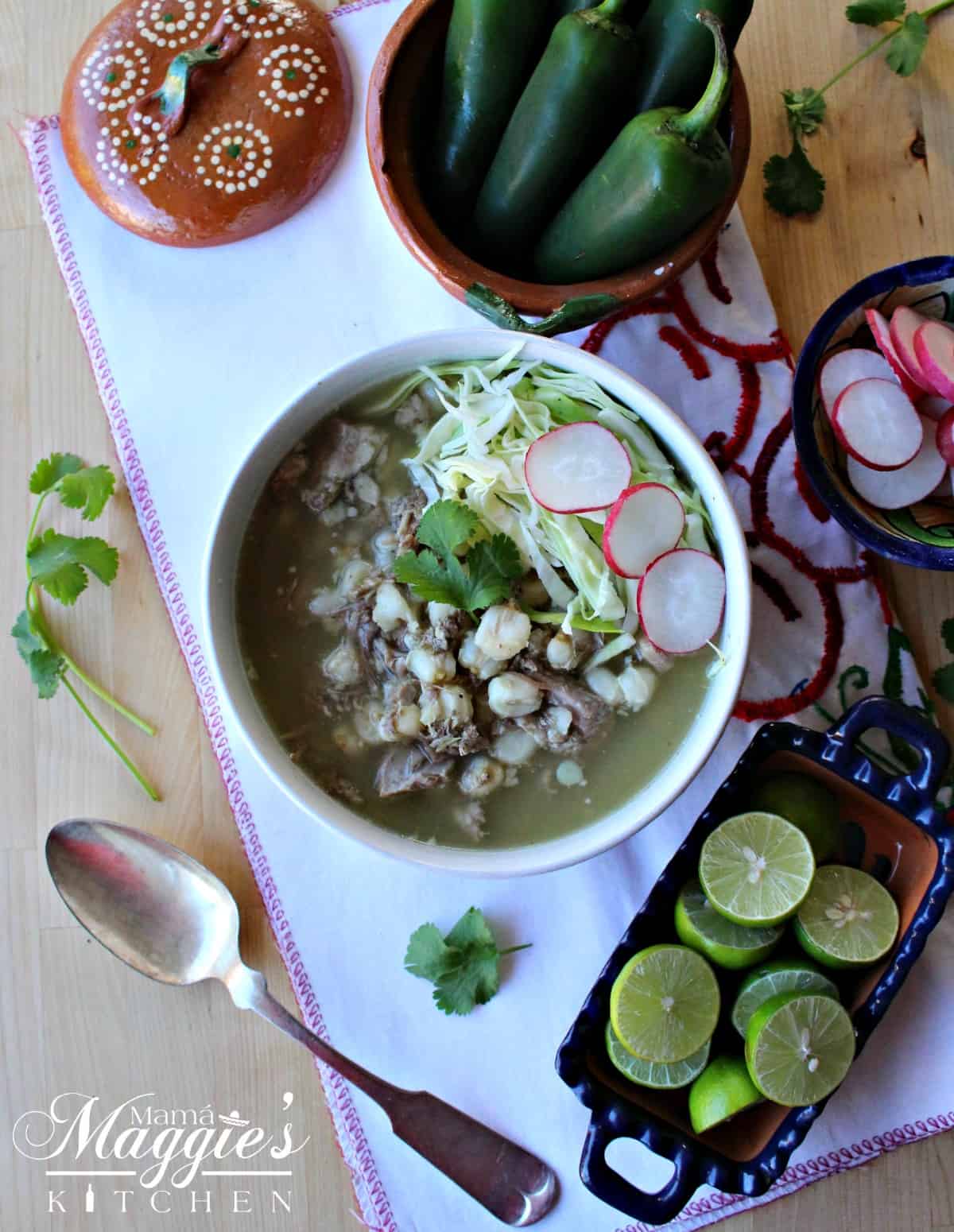 Instant Pot Pozole Verde in a white bowl surrounded by the toppings.