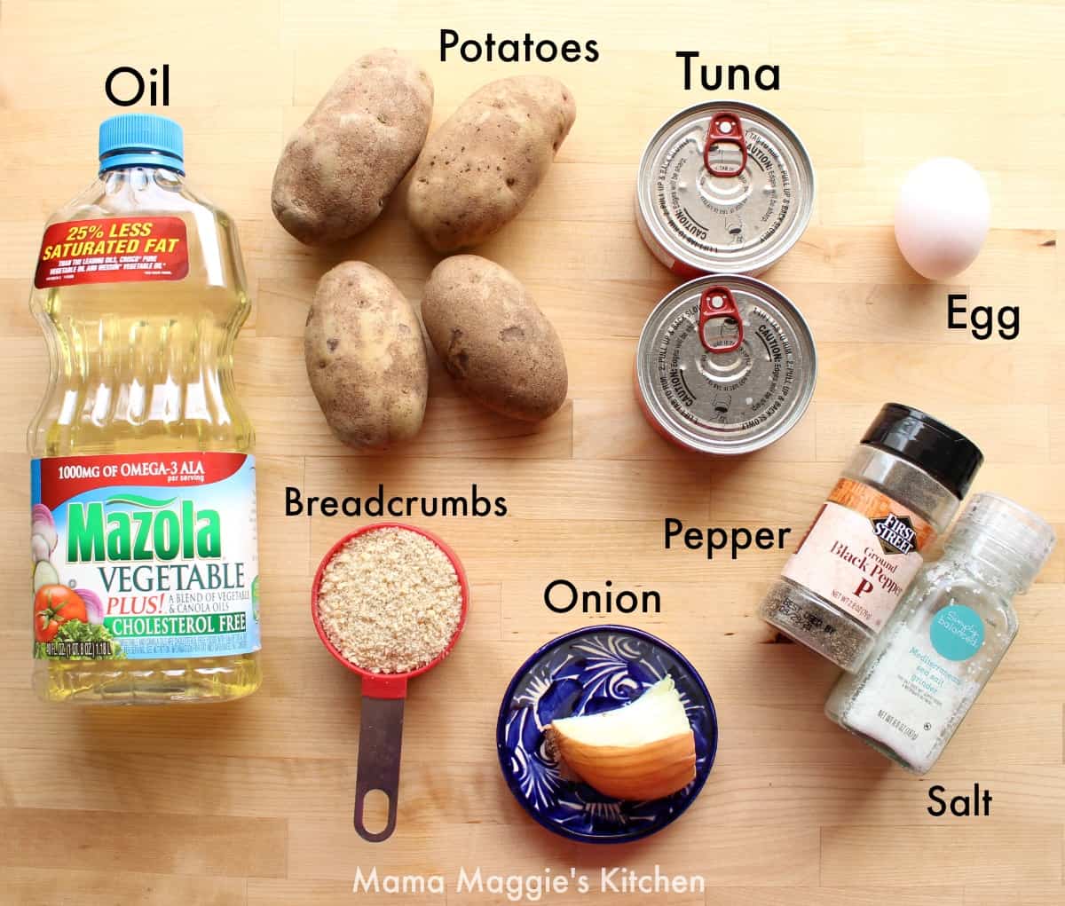 The ingredients for Tortitas de Papa con Atun on a wooden surface.