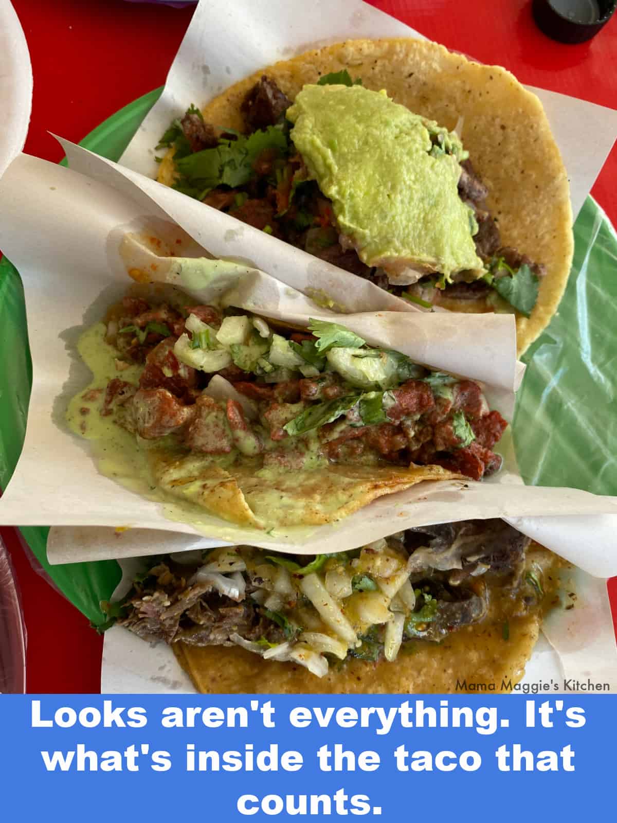 A picture of three tacos served on a plate.
