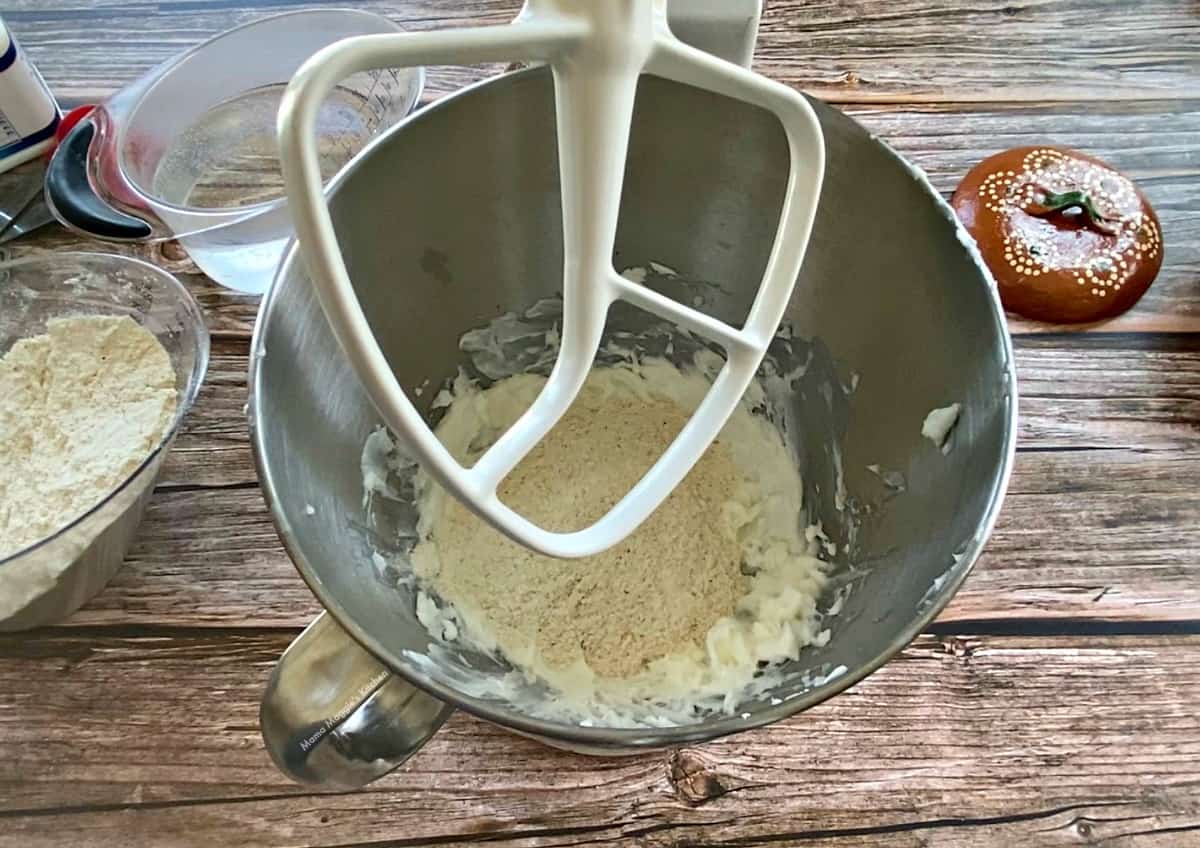 A Kitchen Aid with whipped shortening and masa harina in the bowl. 